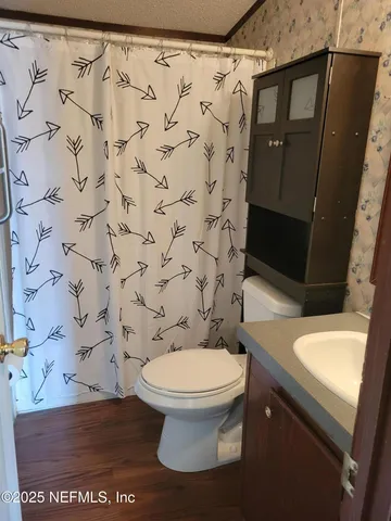 a bathroom with a toilet and a sink