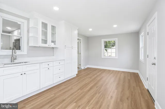 a view of a kitchen counter space with windows