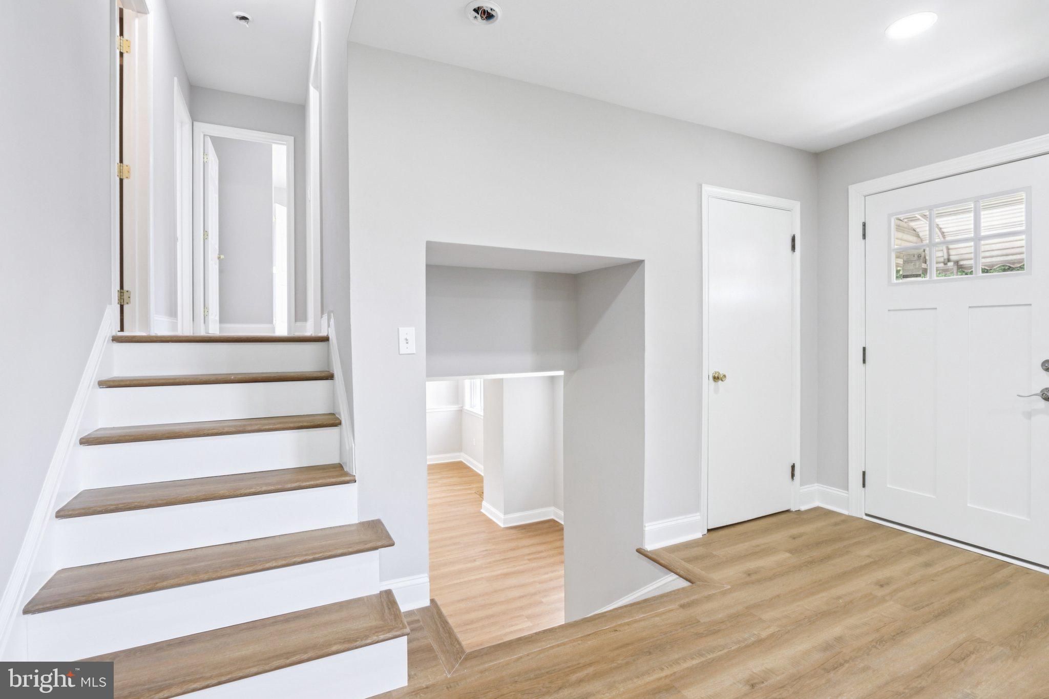 1 Russell Road New Castle, DE 19720 - Photo 24 of 49 a view of an entryway with wooden floor and windows