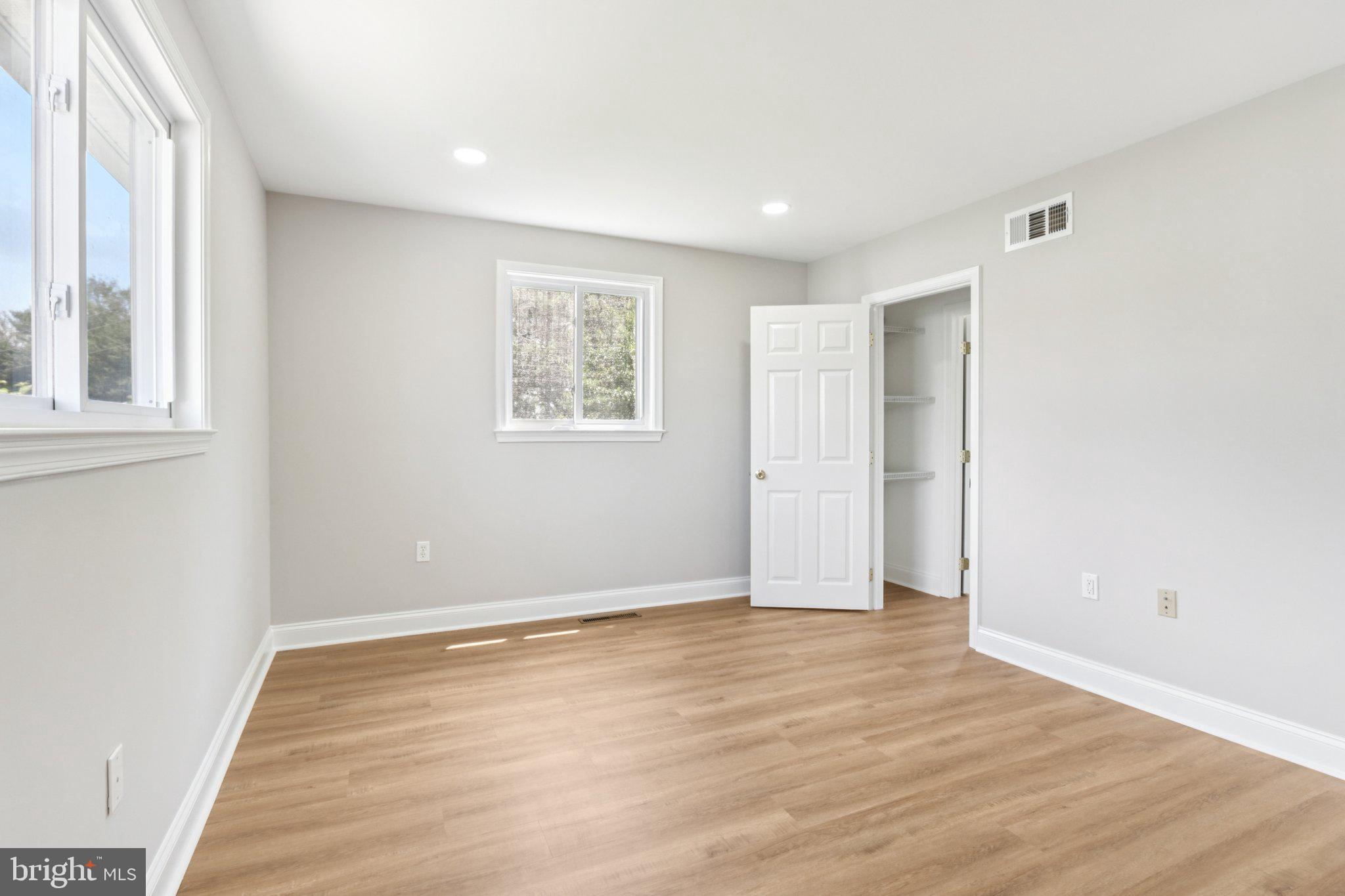 1 Russell Road New Castle, DE 19720 - Photo 30 of 49 a view of an empty room with wooden floor and a window