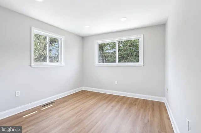 a view of room with window and hardwood floor