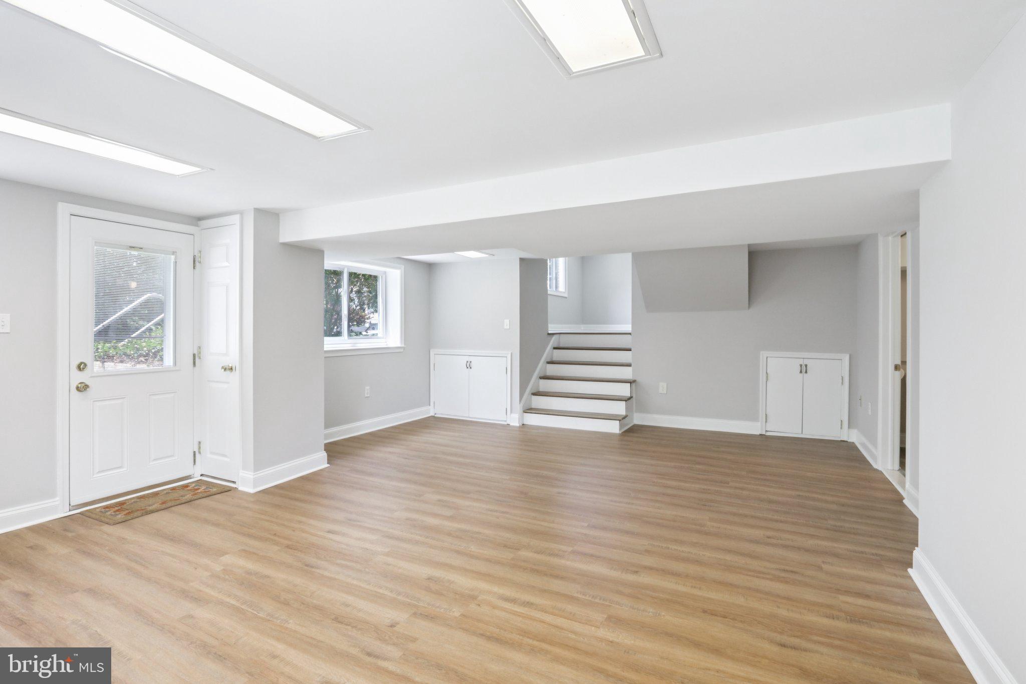 1 Russell Road New Castle, DE 19720 - Photo 38 of 49 a view of empty room with wooden floor and window