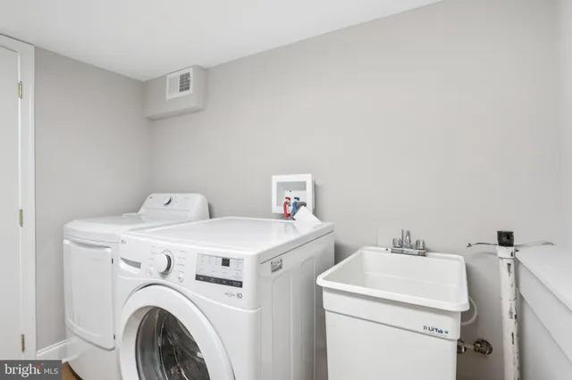 a utility room with dryer and washer