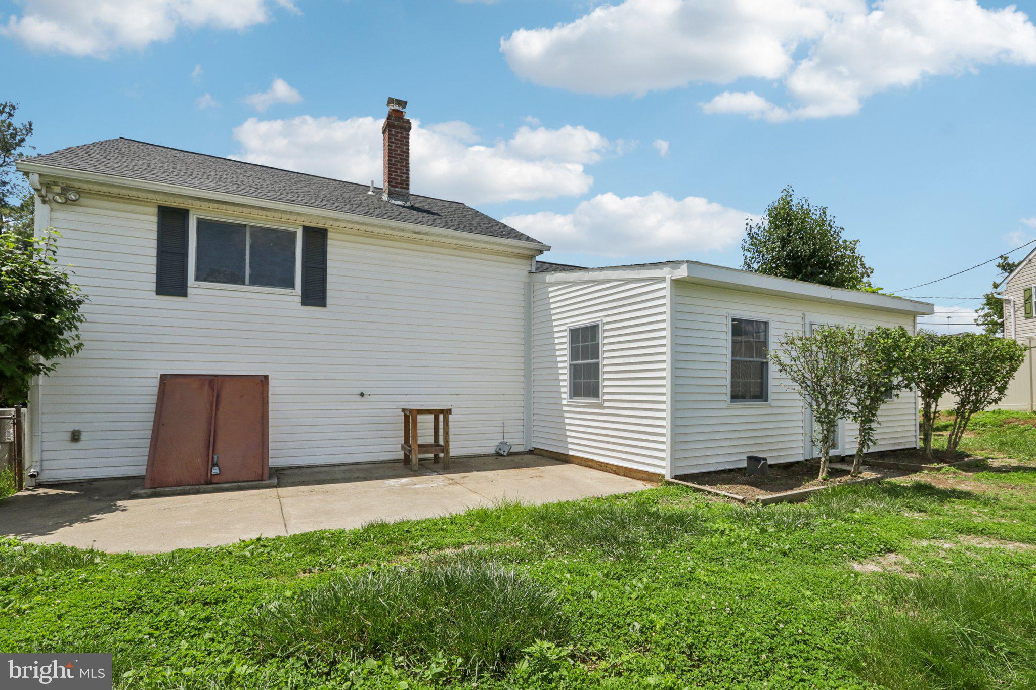 1 Russell Road New Castle, DE 19720 - Photo 44 of 49 a front view of a house with a yard