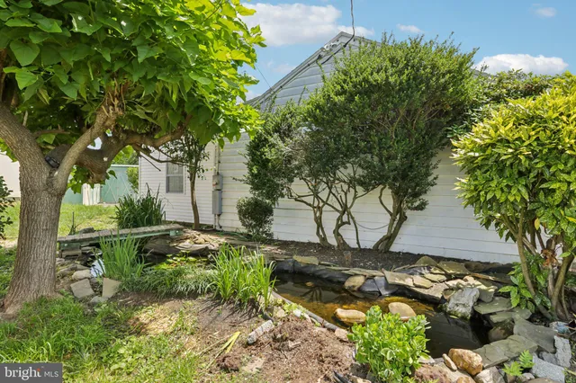 a backyard of a house with lots of green space