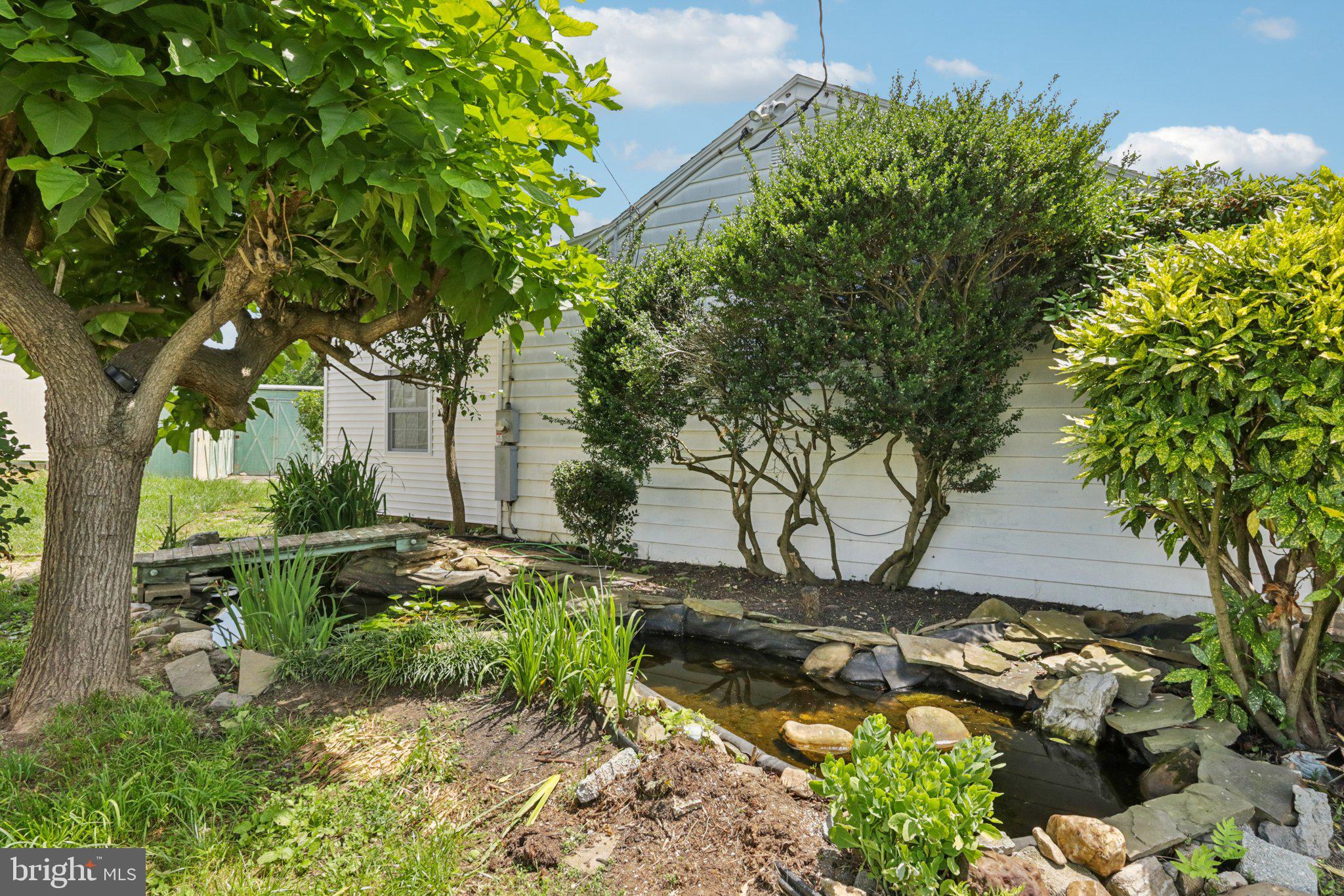 1 Russell Road New Castle, DE 19720 - Photo 46 of 49 a backyard of a house with lots of green space
