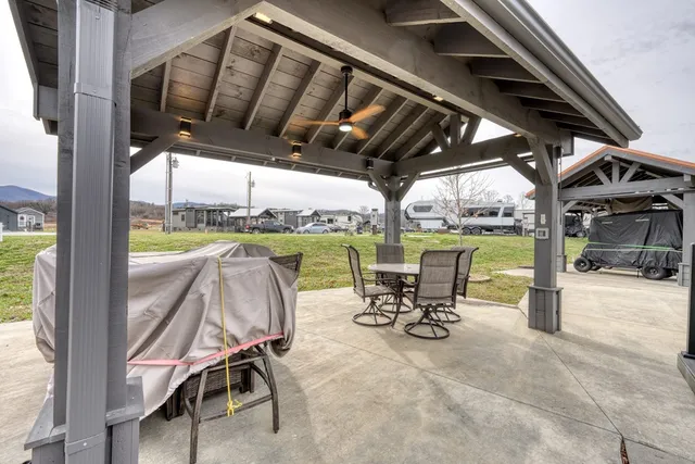 a view of a chairs and table in patio