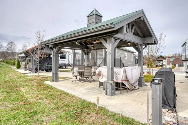a view of a house with swimming pool and sitting area
