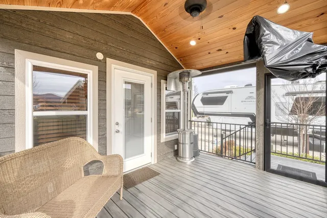 a view of a house with wooden deck