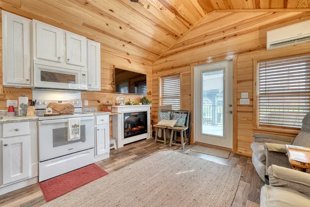 a kitchen with stainless steel appliances granite countertop a refrigerator sink and cabinets
