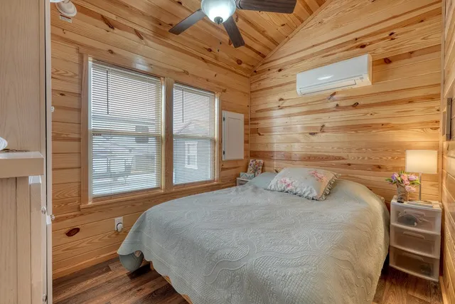 a bedroom with a bed and a cabinets