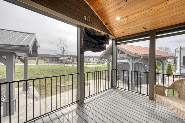 a view of a porch with wooden floor of the house