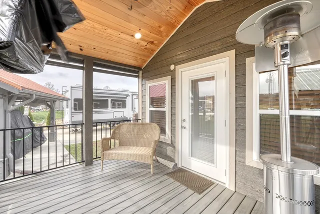 a view of a balcony with wooden floor