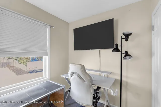 a workspace with furniture and window