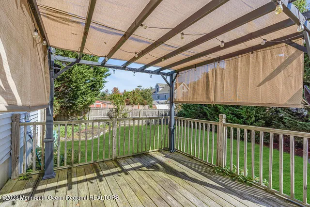 a view of a balcony with wooden floor