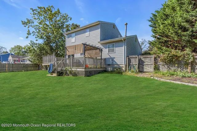 a front view of house with a garden