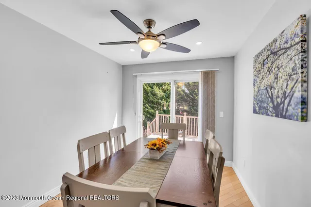 a view of a dining room with furniture window and outside view