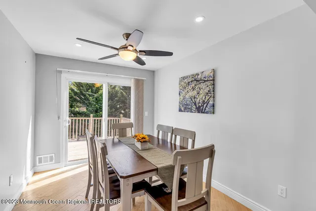 a view of a dining room with furniture window and outside view