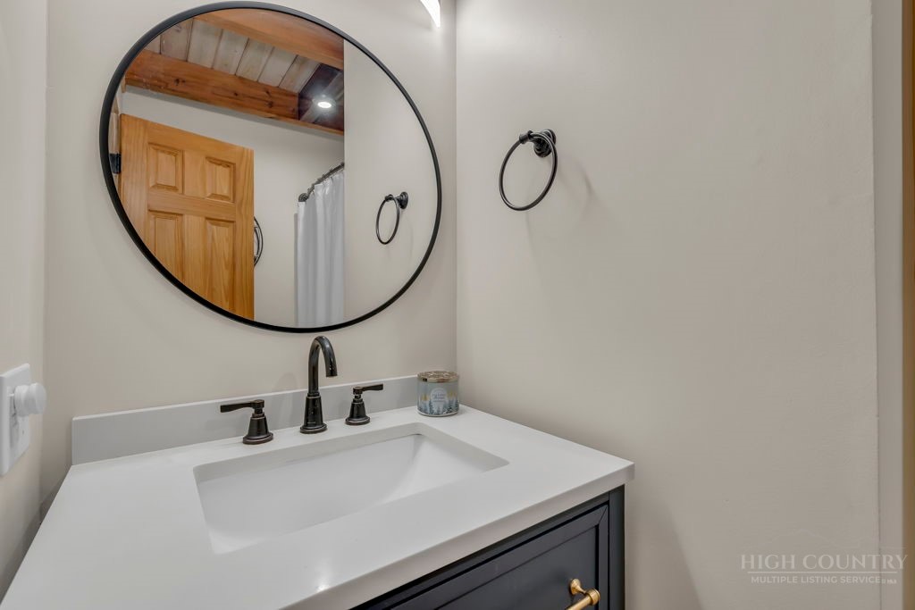 192 Dewitt Barnett Road Vilas, NC 28692 - Photo 15 of 32 a bathroom with a sink and a mirror