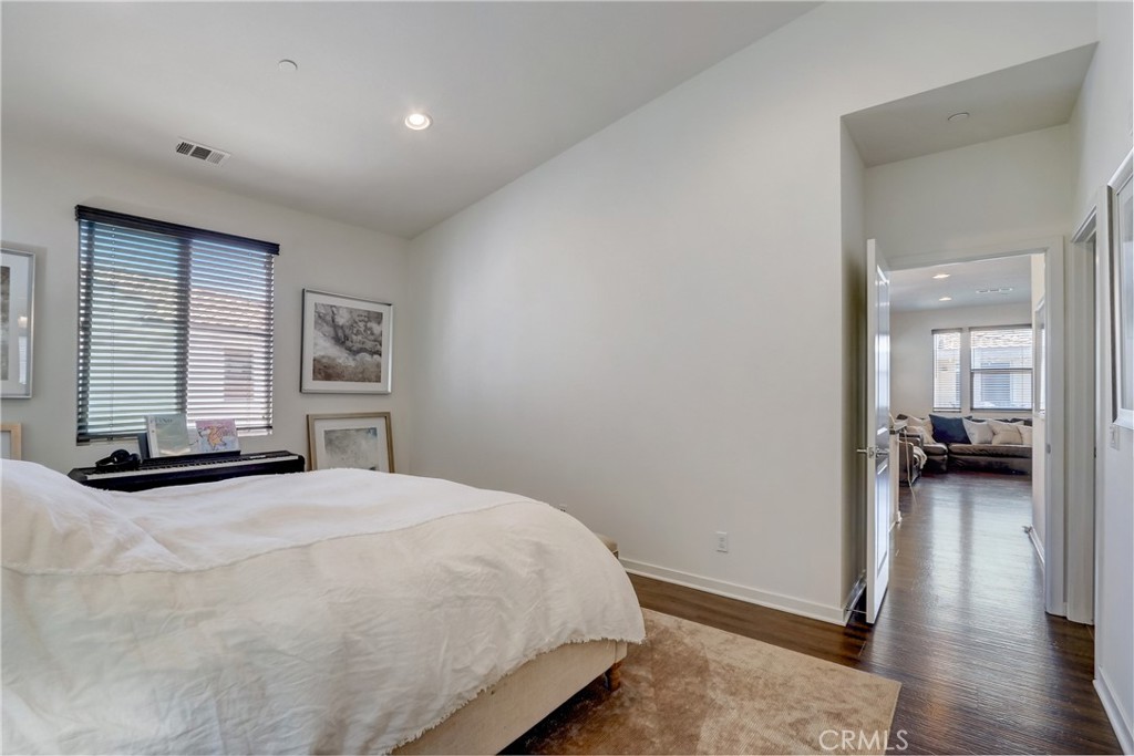44 Hoya Street Rancho Mission Viejo, CA 92694 - Photo 12 of 32 a bedroom with a bed and a large window