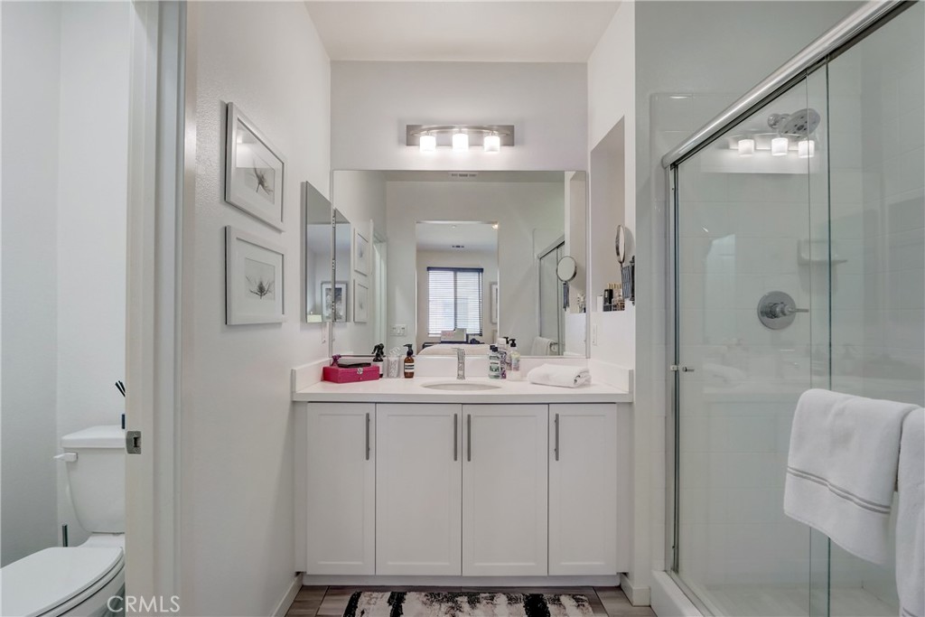 44 Hoya Street Rancho Mission Viejo, CA 92694 - Photo 13 of 32 a bathroom with a sink a toilet and shower