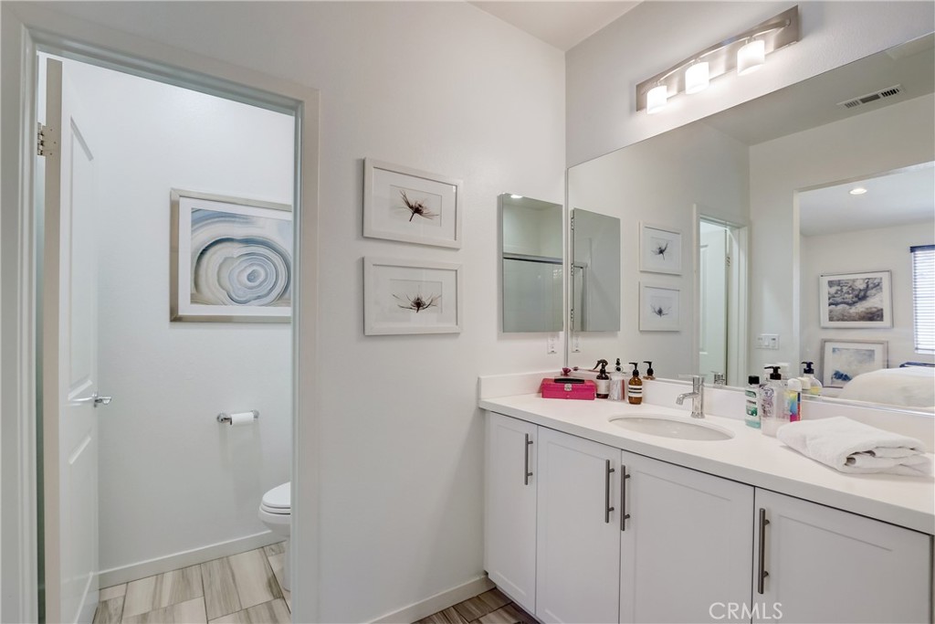 44 Hoya Street Rancho Mission Viejo, CA 92694 - Photo 14 of 32 a bathroom with a sink vanity and a mirror