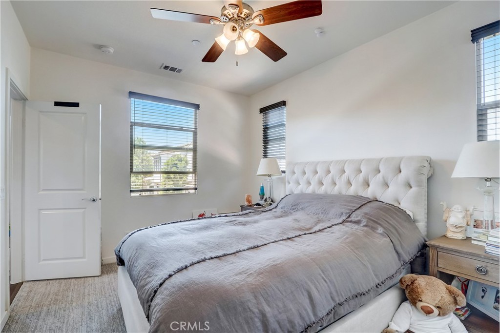 44 Hoya Street Rancho Mission Viejo, CA 92694 - Photo 15 of 32 a bedroom with bed and window