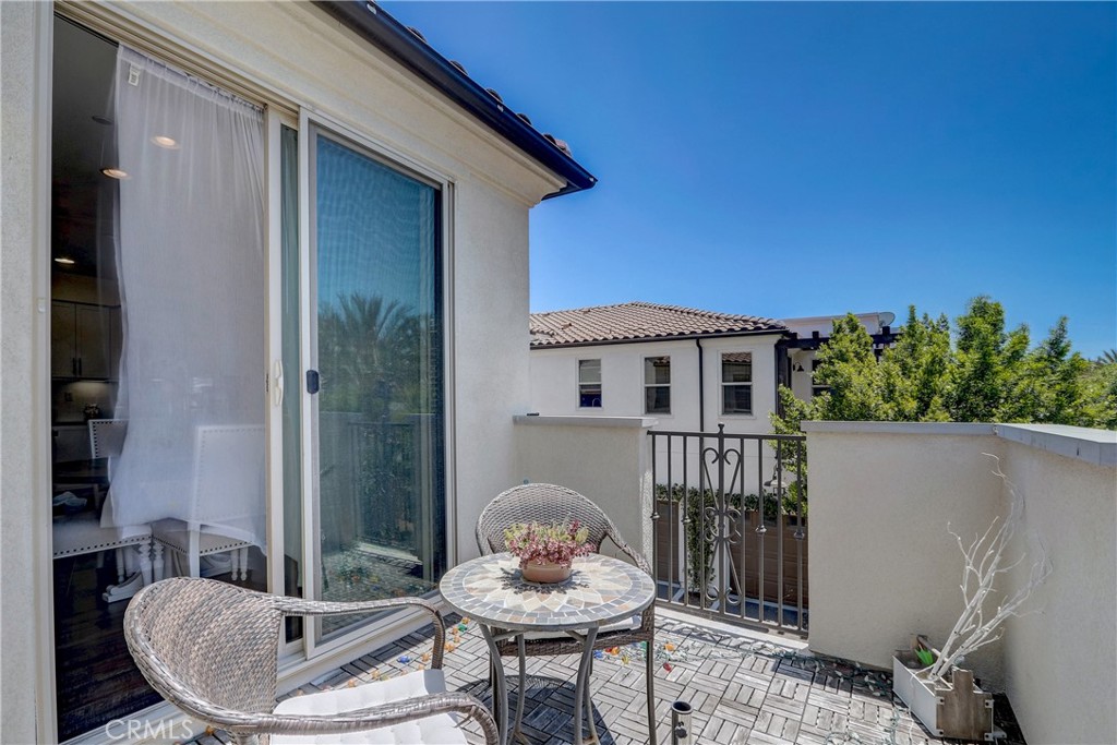44 Hoya Street Rancho Mission Viejo, CA 92694 - Photo 21 of 32 a balcony with table and chairs