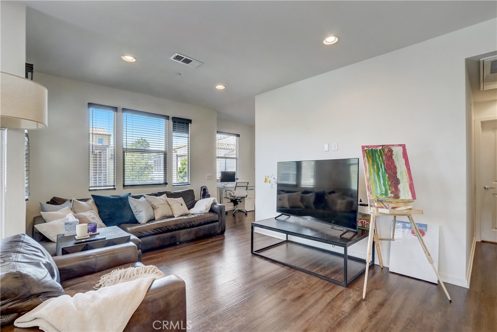 44 Hoya Street Rancho Mission Viejo, CA 92694 - Photo 4 of 32 a living room with furniture and a flat screen tv