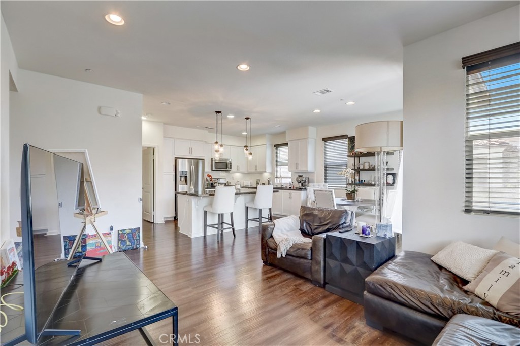 44 Hoya Street Rancho Mission Viejo, CA 92694 - Photo 6 of 32 a living room with furniture and a view of kitchen