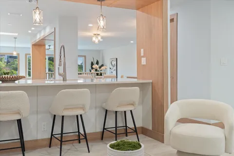 a kitchen with stainless steel appliances refrigerator oven and microwave