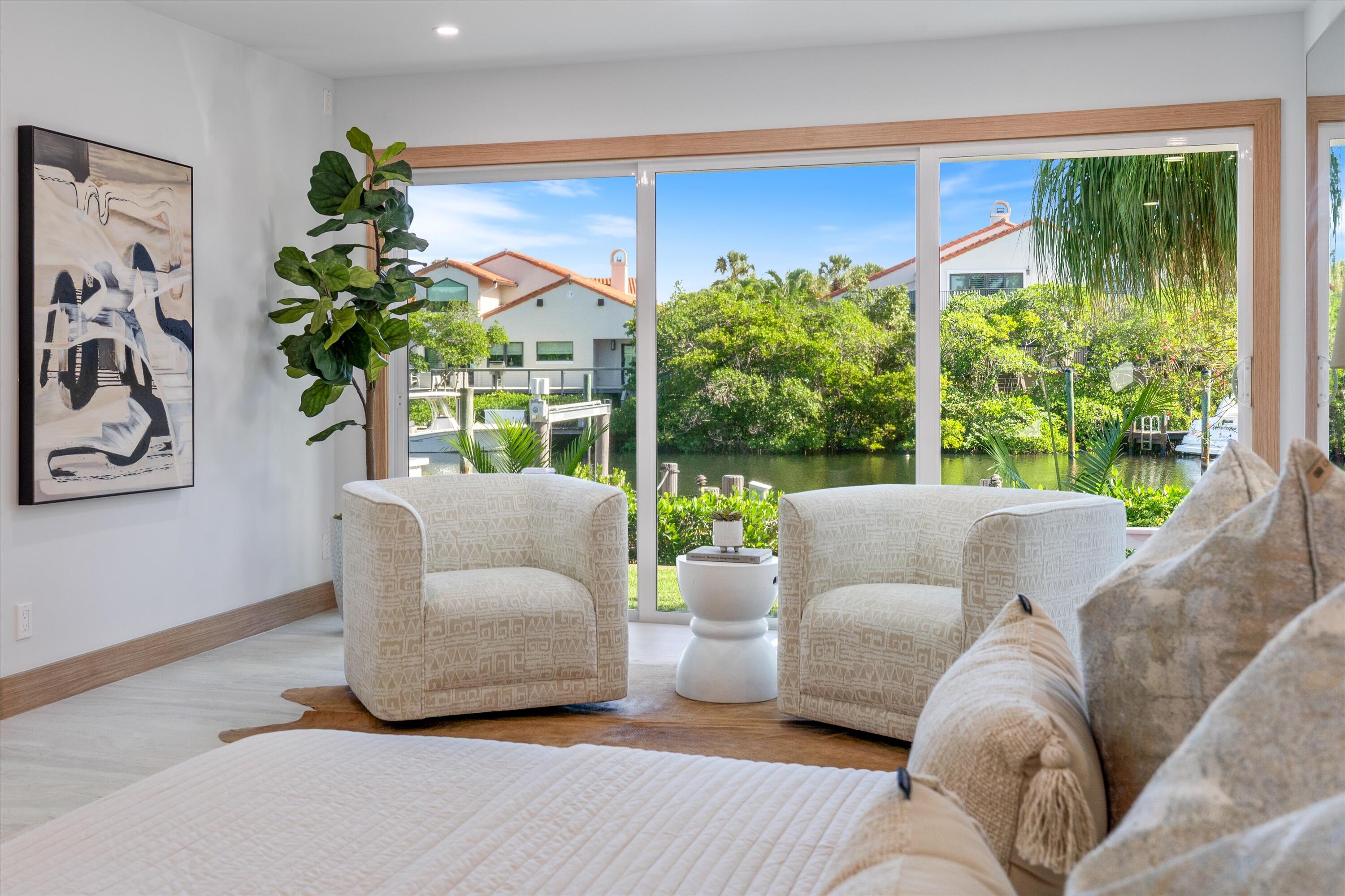 17036 Bay Street Jupiter, FL 33477 - Photo 30 of 69 a living room with furniture and a large window