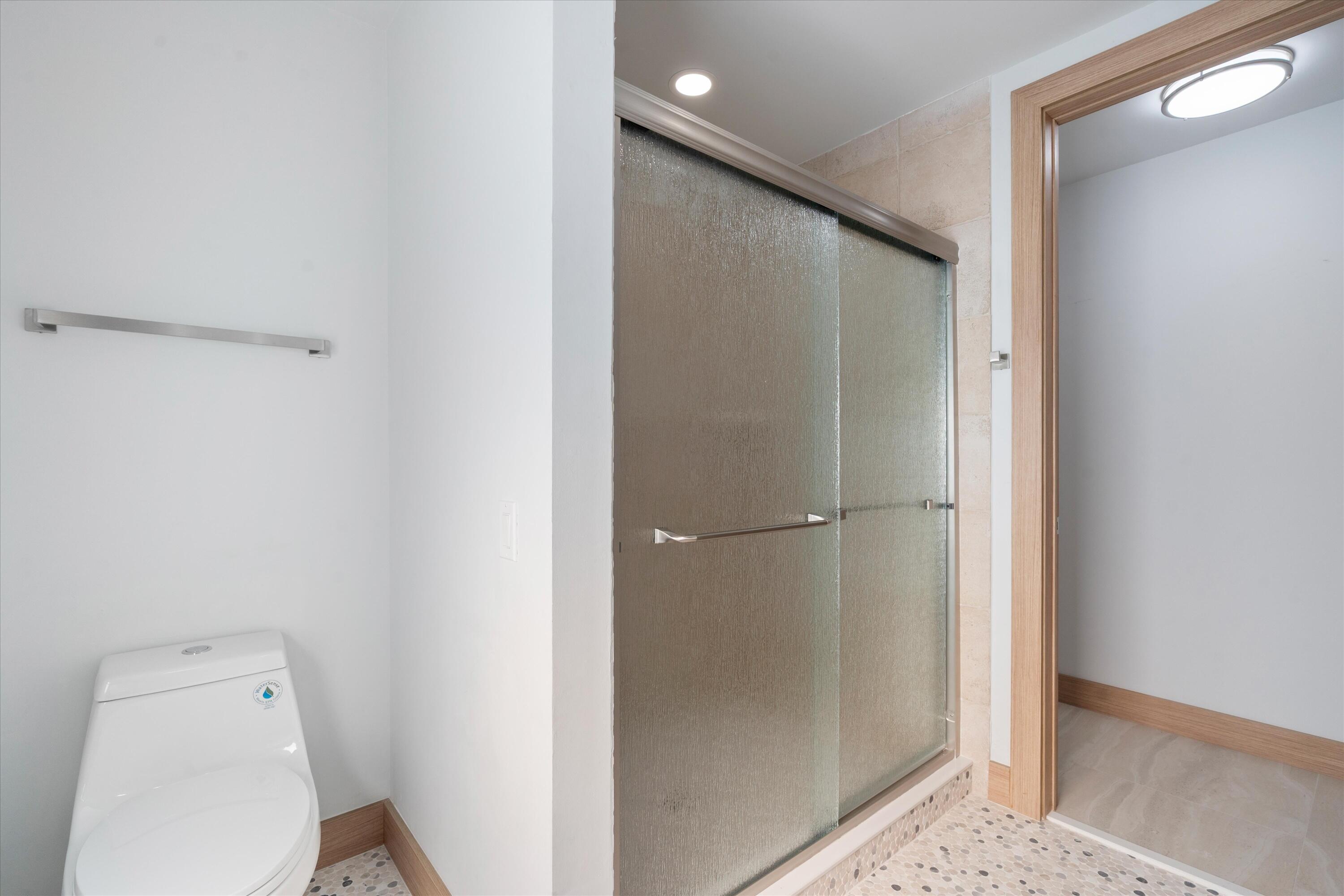 17036 Bay Street Jupiter, FL 33477 - Photo 43 of 69 a bathroom with a toilet and a shower