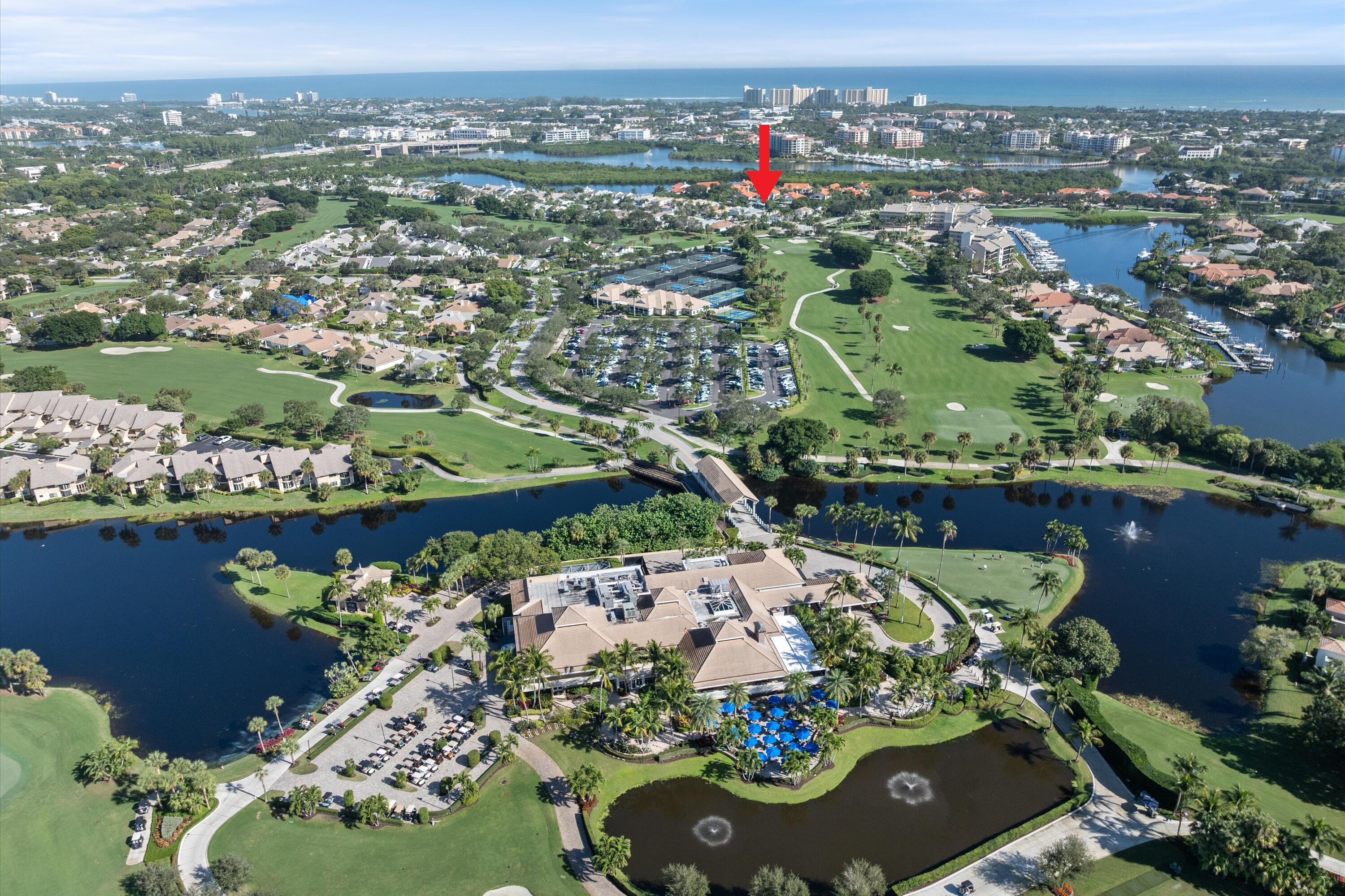 17036 Bay Street Jupiter, FL 33477 - Photo 63 of 69 an aerial view of a house with a lake view
