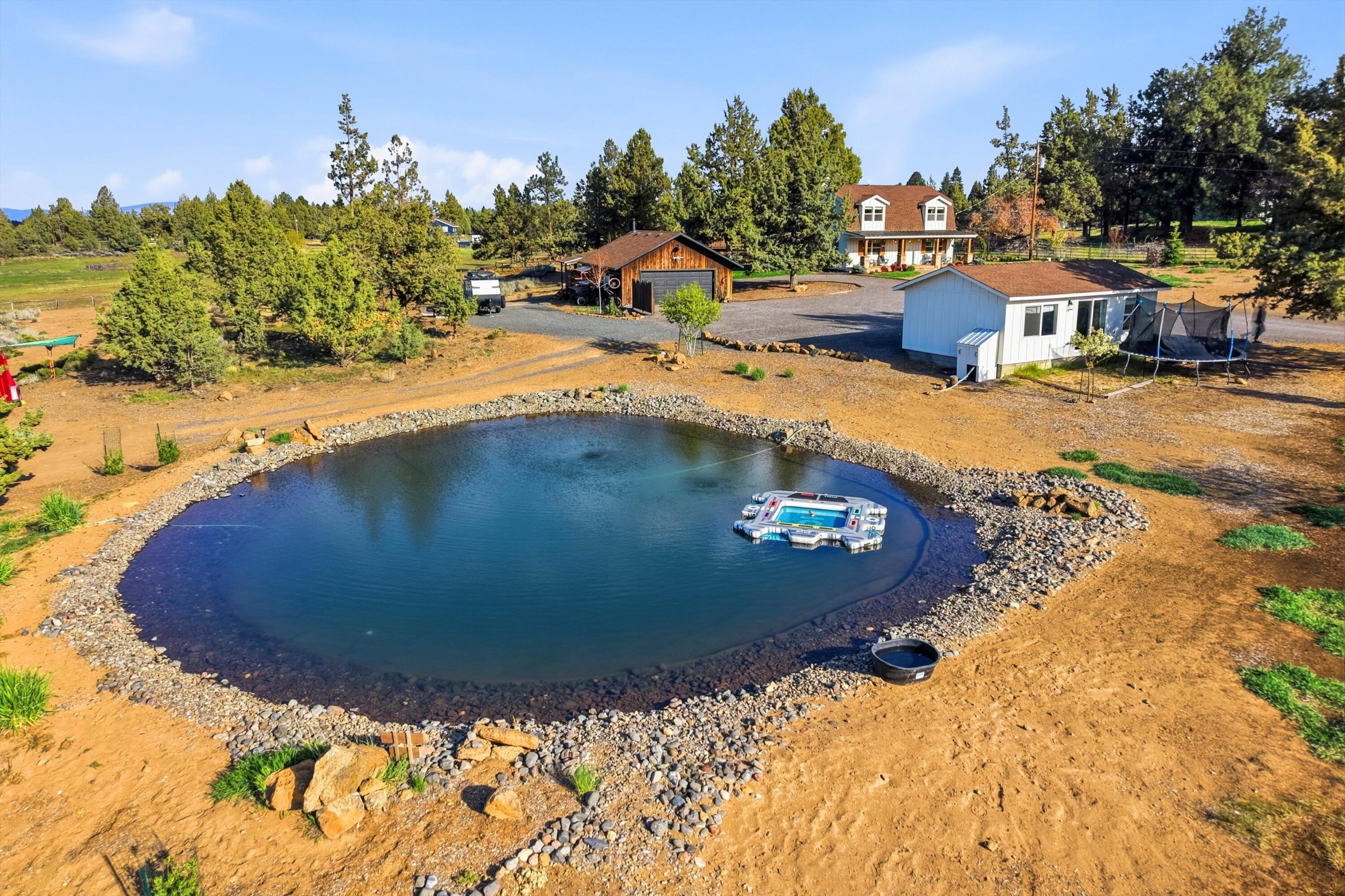 61280 Larsen Road Bend, OR 97702 - Photo 47 of 58 a view of a swimming pool with an outdoor space