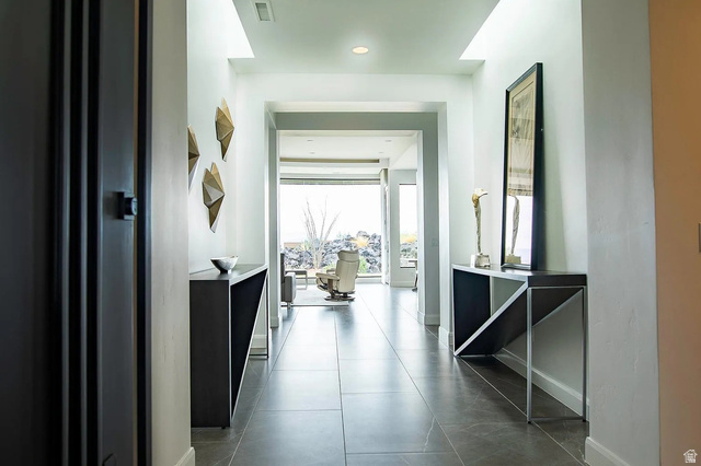 1500 Split Rock, Unit 150 Ivins, UT 84738 - Photo 5 of 14 Spacious hallway featuring large format tile flooring, recessed lighting, and bright white walls