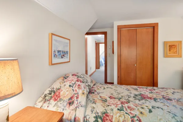 a bedroom with bed and a window