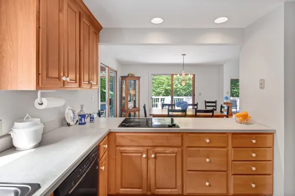a kitchen with sink cabinets and window