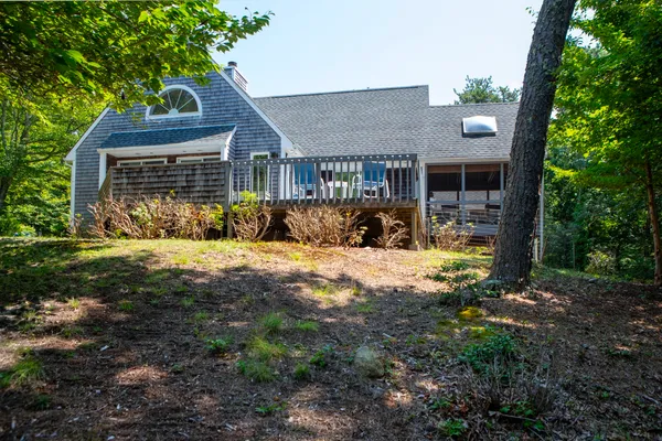 a view of house with yard