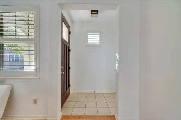 a view of an empty room with windows
