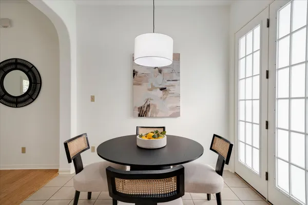 a view of a dining room with furniture and a window