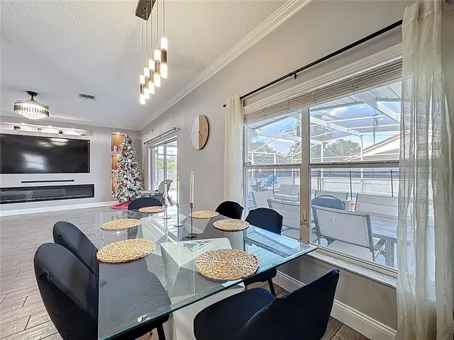 a view of a dining room with furniture window and outside view