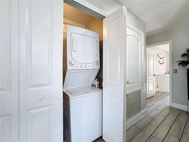a view of a storage and utility room with washer and dryer