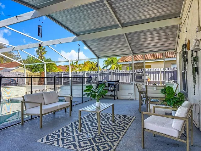 a view of a backyard with sitting area