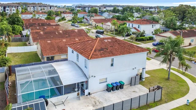 an aerial view of a house with a yard