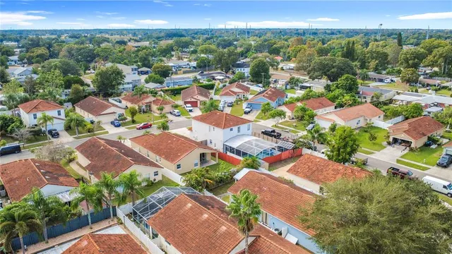 an aerial view of residential houses with outdoor space