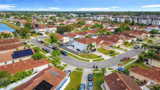 an aerial view of residential houses with outdoor space