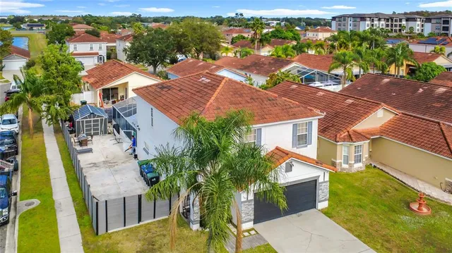 an aerial view of residential houses with outdoor space