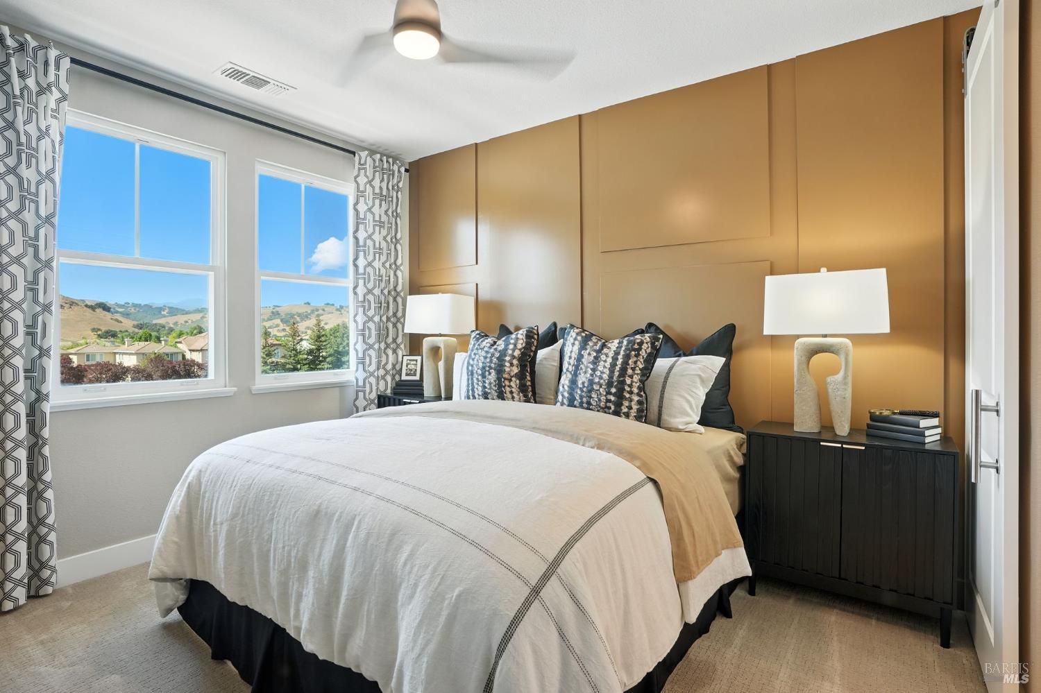 104 Cardamom Lane, Unit 1103 Morgan Hill, CA 95037 - Photo 11 of 19 a bed room with a bed and a night stand