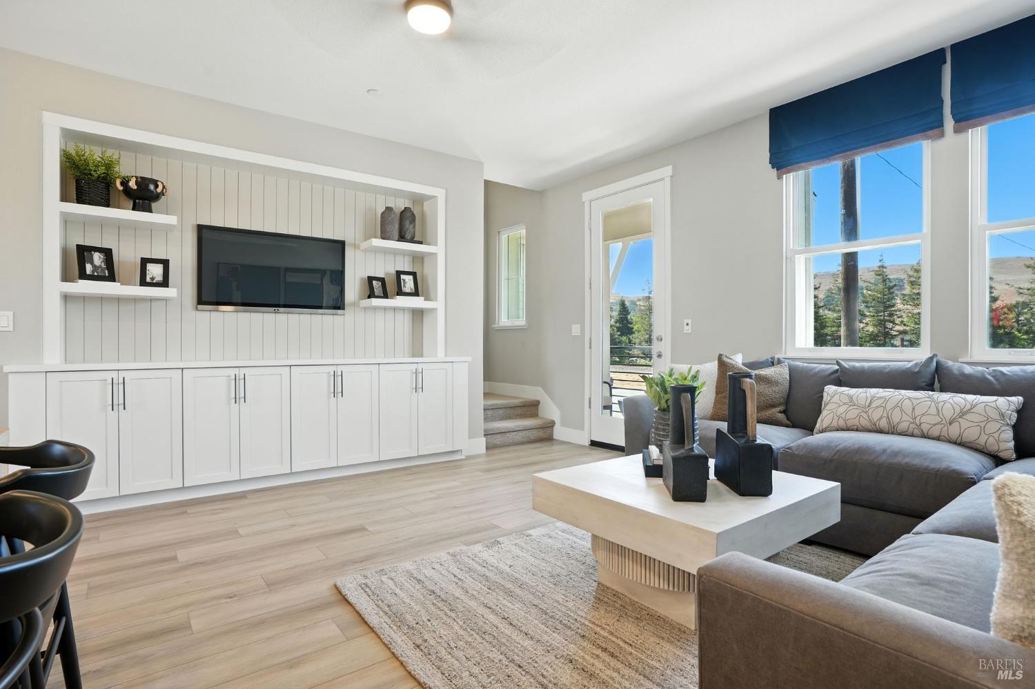 104 Cardamom Lane, Unit 1103 Morgan Hill, CA 95037 - Photo 4 of 19 a living room with furniture and a flat screen tv